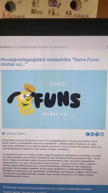 Rakstas par pasākumu ekrānā.